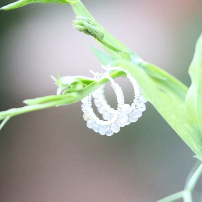 Labradorite beads bound on a silver hoop with a French lock