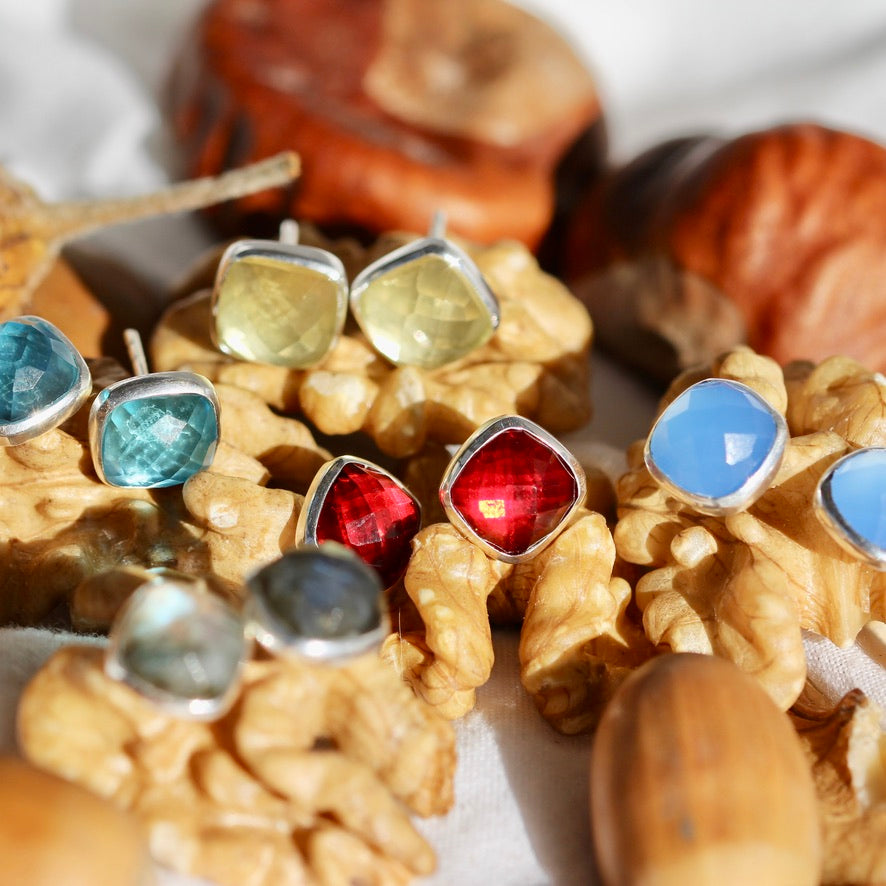 faceted gemstone studs in a variety of semi precious stones